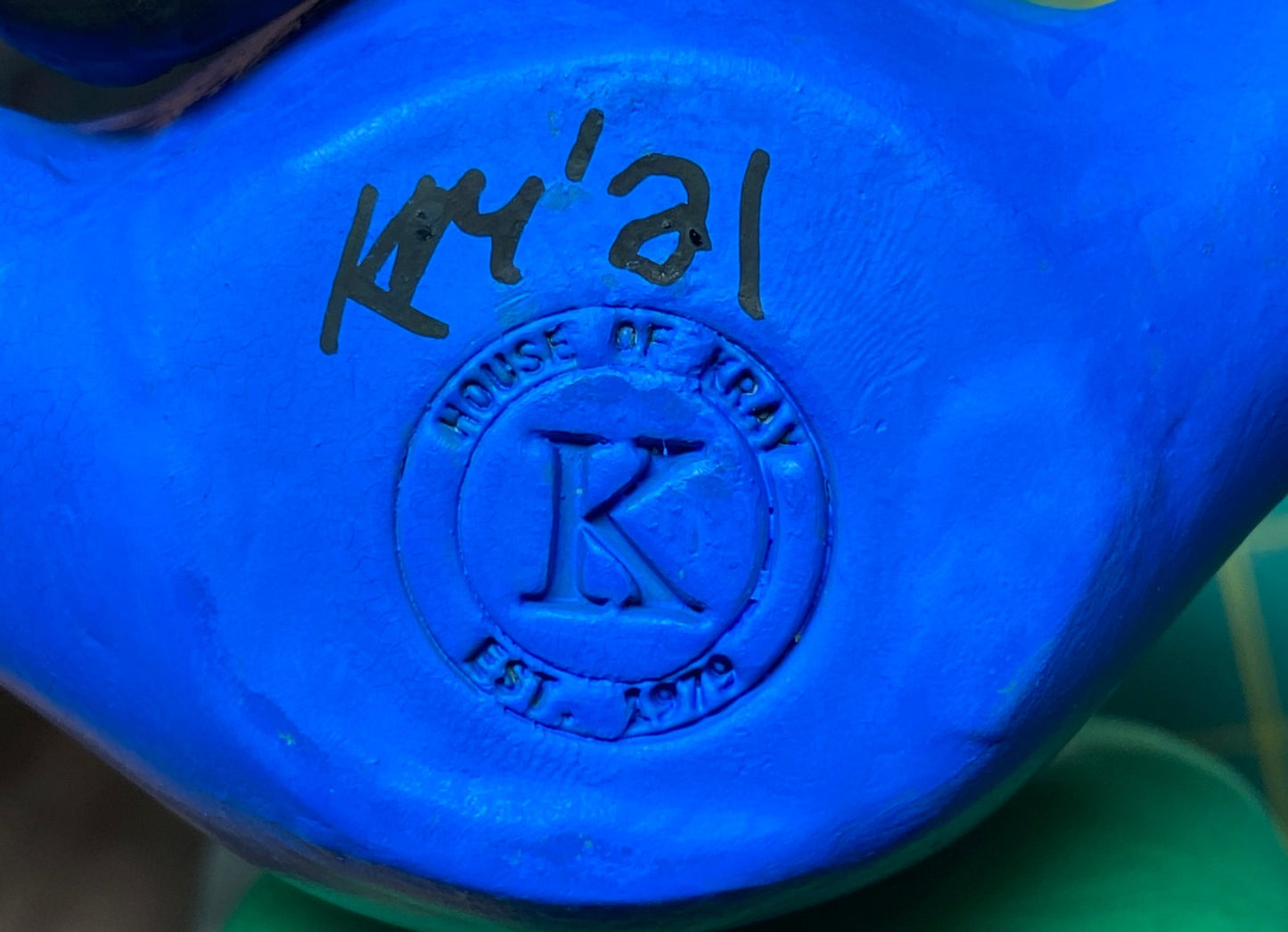 Closeup of House of Kray stamp on bottom of statue.