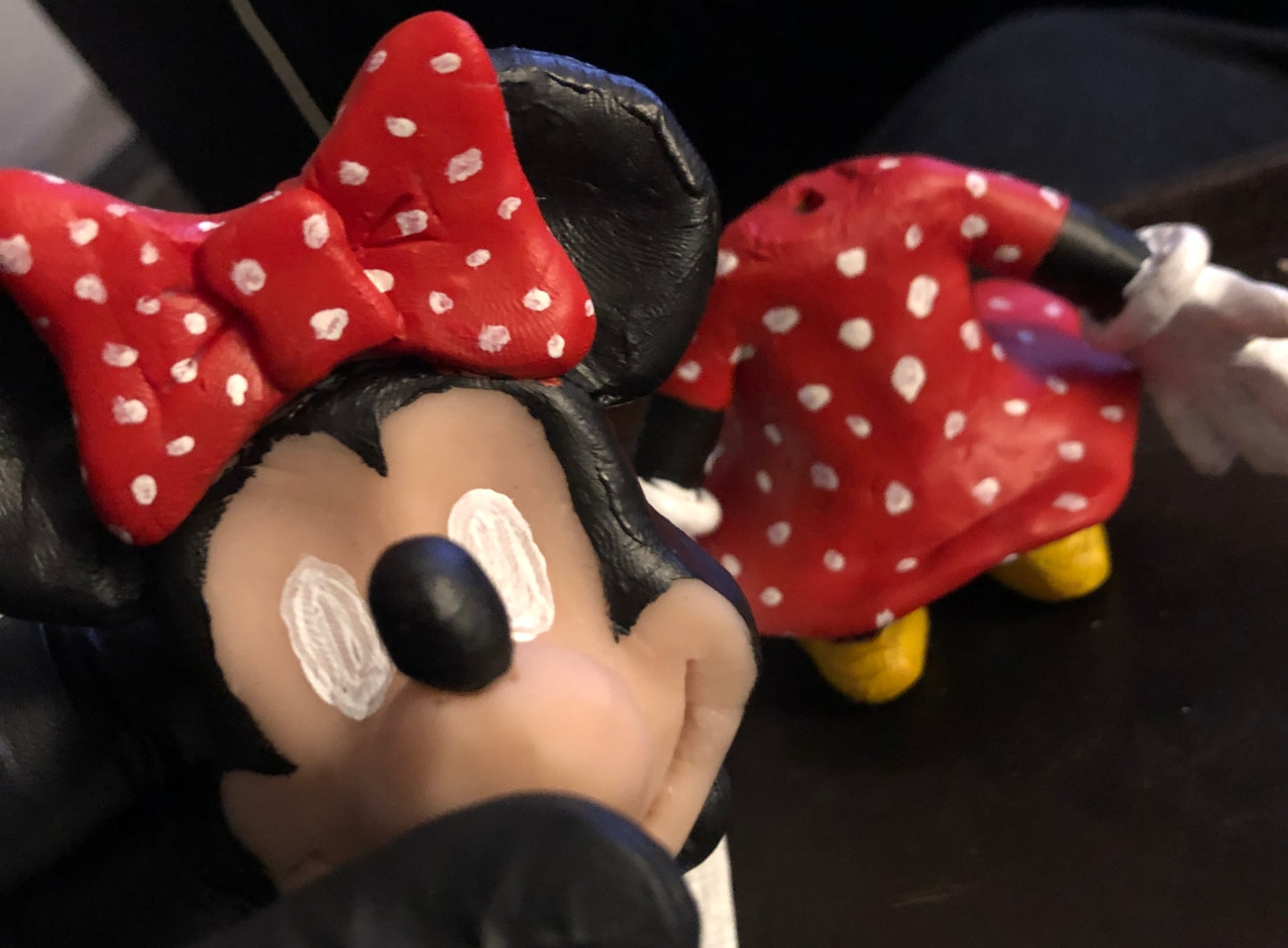 Closeup of Minnie head with painting in progress. Body in the background.