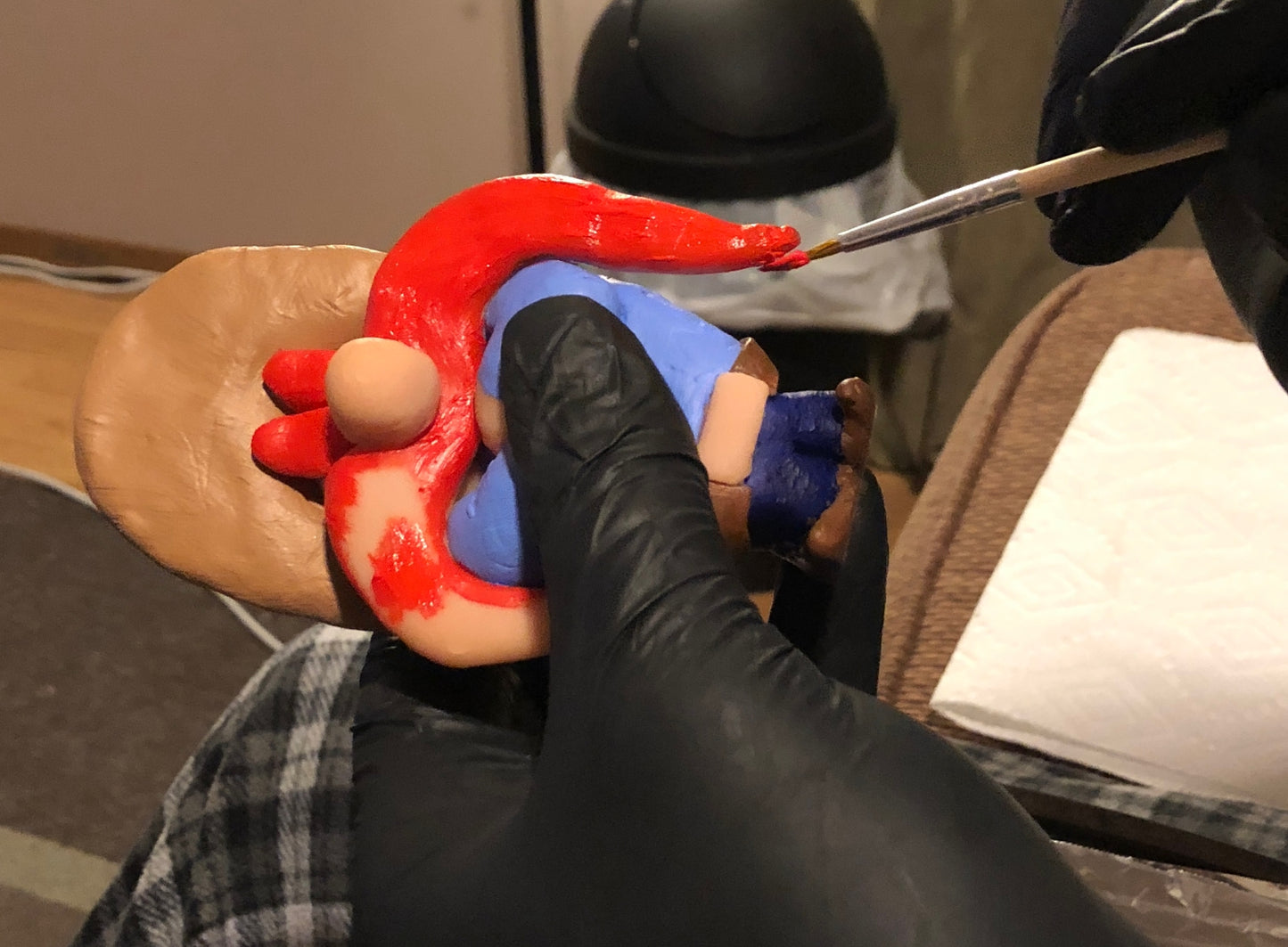Painting of Sams moustache in progress.